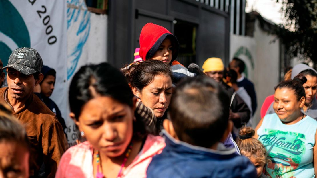 Gabriela, center, is still with hundreds of migrants who made the trek north.