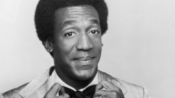 1969:  Promotional studio portrait of American actor and comedian Bill Cosby adjusting his bow tie, from his television series, 'The Bill Cosby Show'.  (Photo by Hulton Archive/Getty Images)