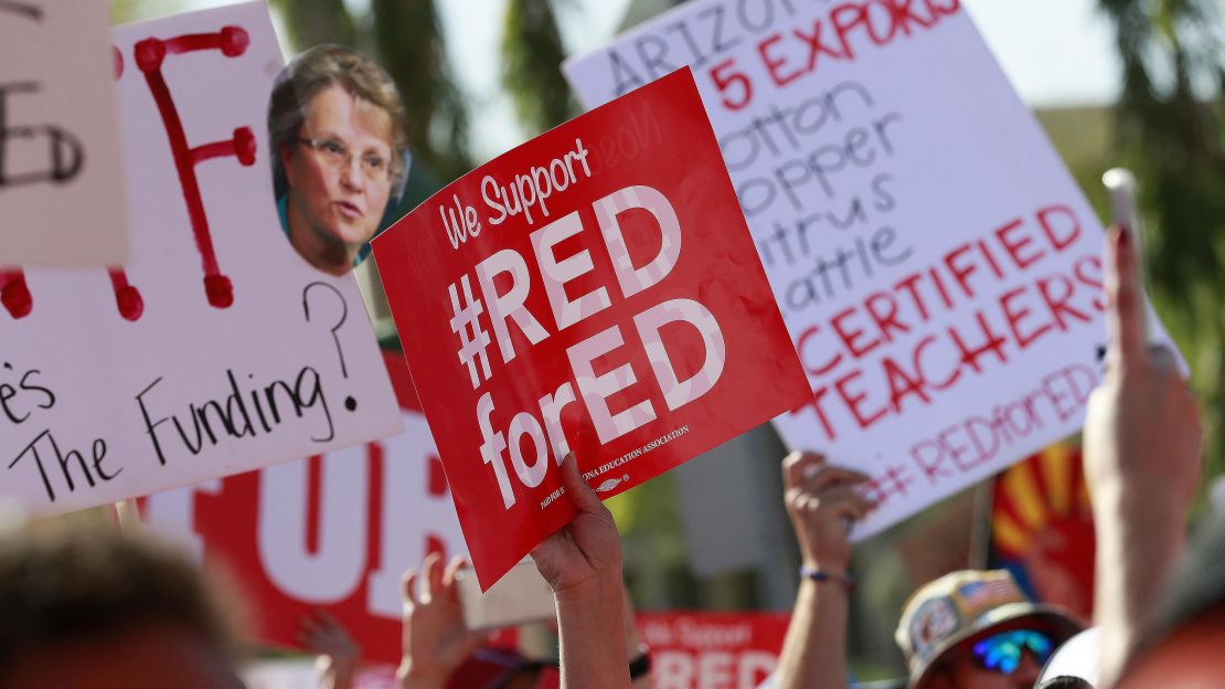 Teachers rally outside the Capitol in Phoenix on Friday during  their second day of walkouts. 