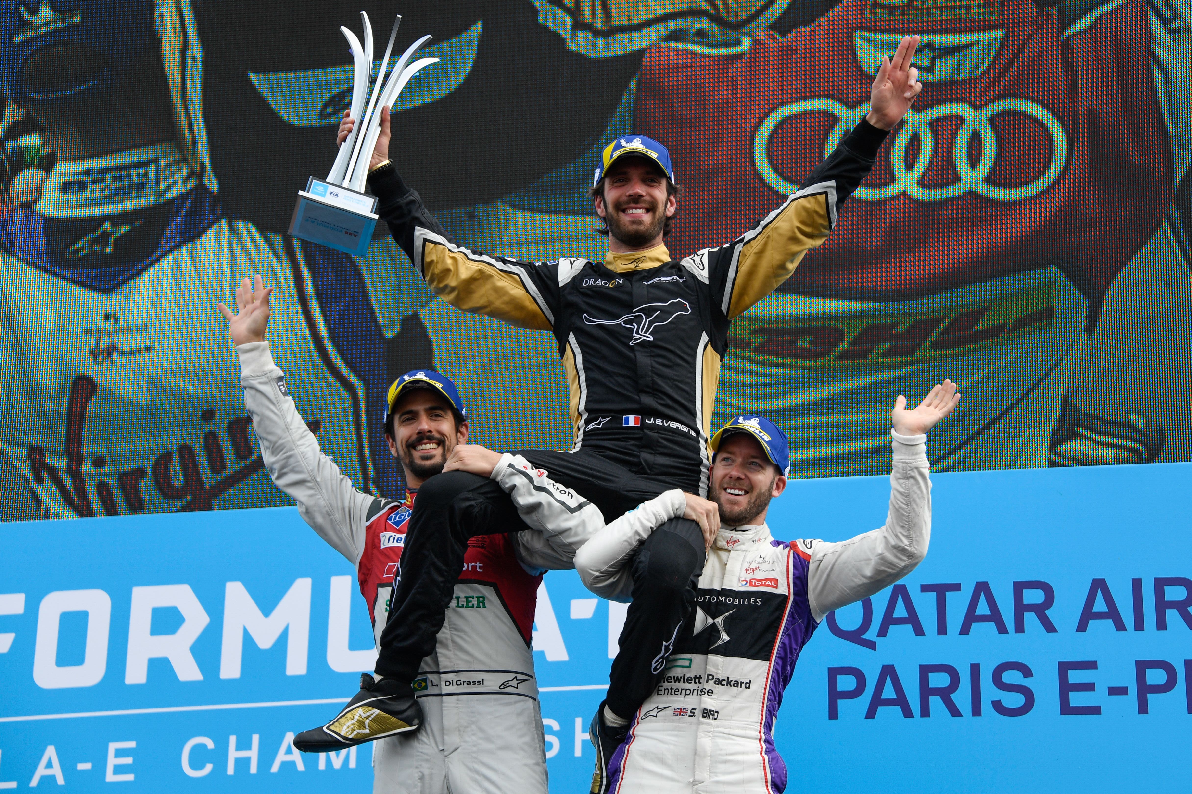 Vergne was hoisted by runner-up Lucas di Grassi (left) and Bird after winning the Paris ePrix.