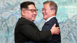TOPSHOT - North Korea's leader Kim Jong Un (L) and South Korea's President Moon Jae-in (R) hug during a signing ceremony near the end of their historic summit at the truce village of Panmunjom on April 27, 2018. - The leaders of the two Koreas held a landmark summit on April 27 after a highly symbolic handshake over the Military Demarcation Line that divides their countries, with the North's Kim Jong Un declaring they were at the "threshold of a new history". (Photo by Korea Summit Press Pool / Korea Summit Press Pool / AFP)        (Photo credit should read KOREA SUMMIT PRESS POOL/AFP/Getty Images)