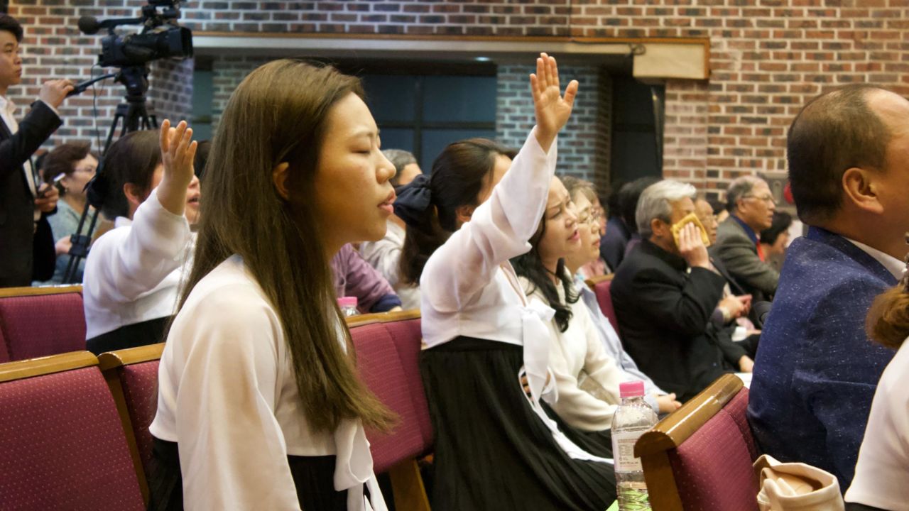 North Korean refugees sing and pray during a church service in Seoul, South Korea on April 28, 2018.