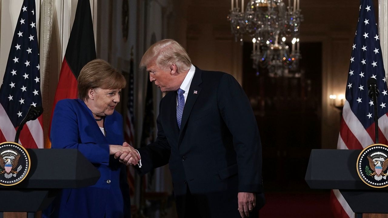 US President Donald Trump shakes hands with German Chancellor Angela Merkel in Washington in April. 