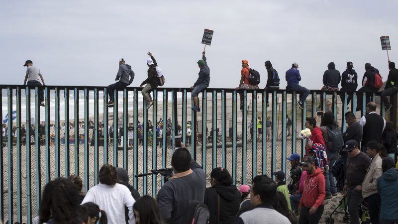 Migrants who traveled with caravan vow to wait at border until