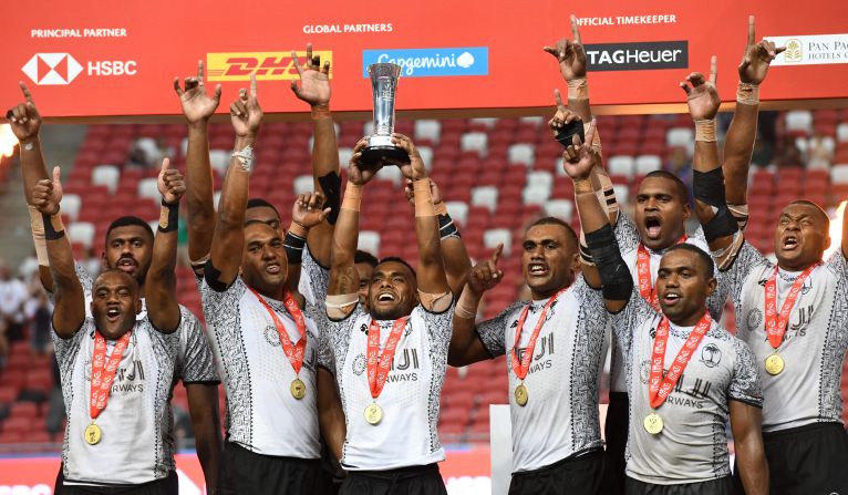 Fiji moved to the top of the standings with a tense victory over Australia in <a href="index.php?page=&url=http%3A%2F%2Fwww.cnn.com%2F2018%2F04%2F29%2Fsport%2Ffiji-singapore-rugby-sevens-hsbc-sevens-world-series-australia-spt-intl%2Findex.html">Singapore</a>.