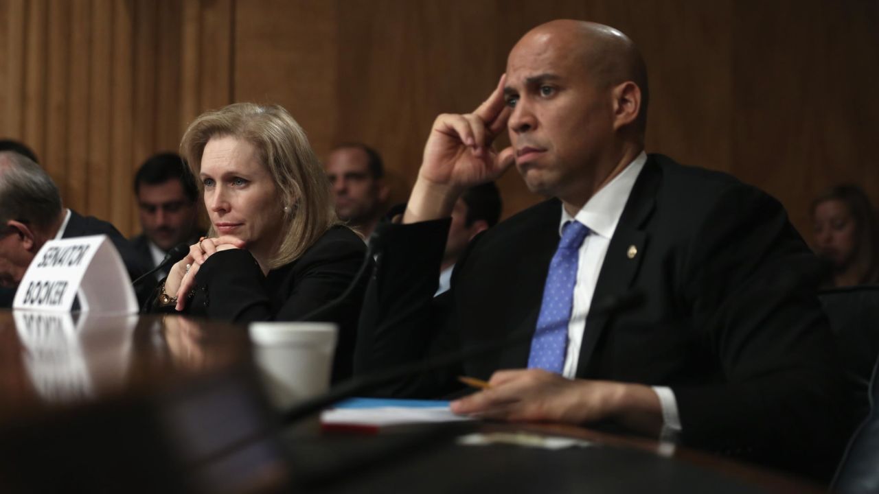 Sen. Cory Booker (D-NJ) and Sen. Kirsten Gillibrand (D-NY) listen during a hearing before the Subcommittee on Emergency Management, Intergovernmental Relations, and the District of Columbia of Senate Homeland Security and Governmental Affairs Committee November 6, 2013 on Capitol Hill in Washington, DC.