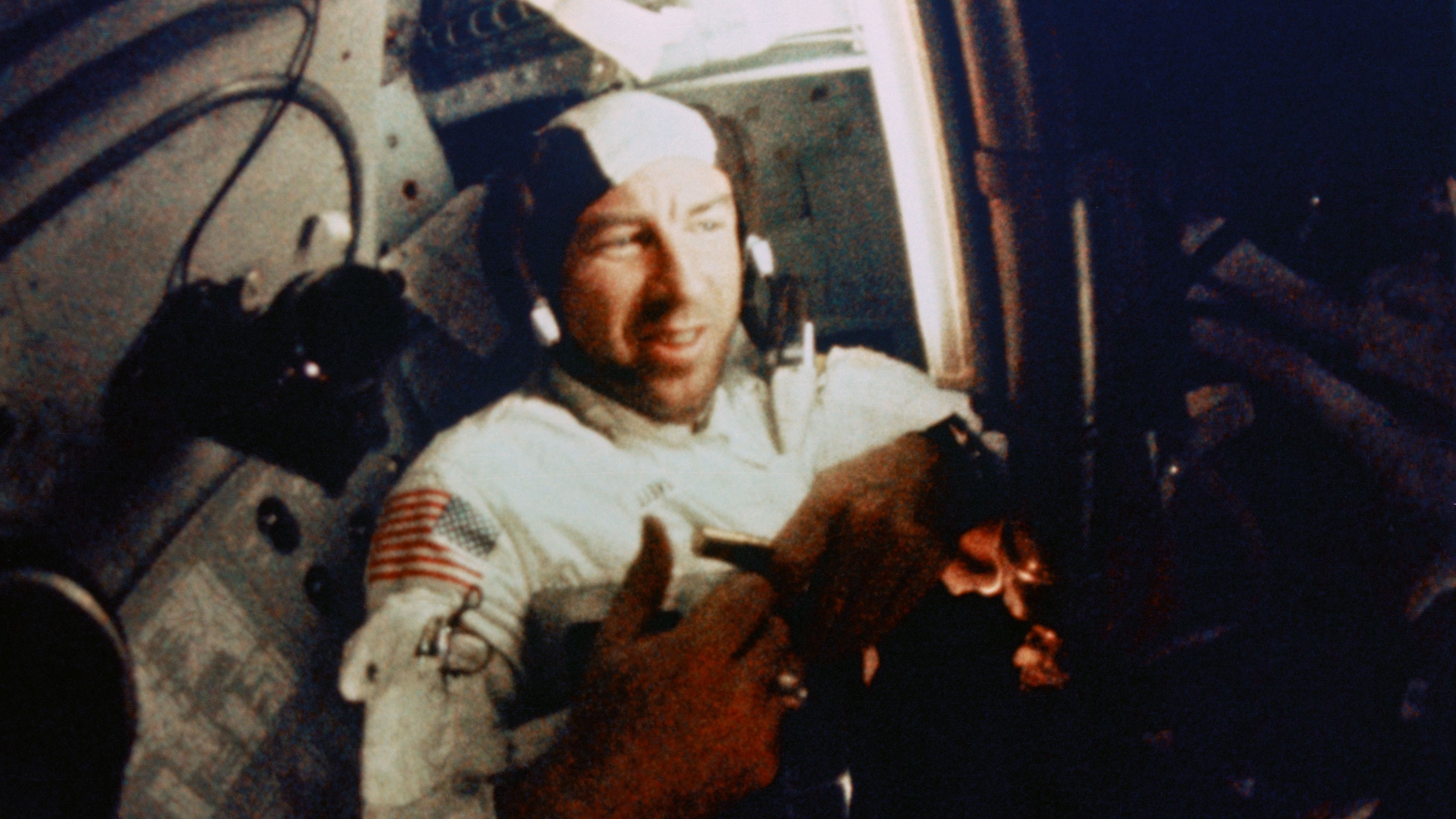 Navigator Jim Lovell works inside Apollo 8's cramped quarters. 