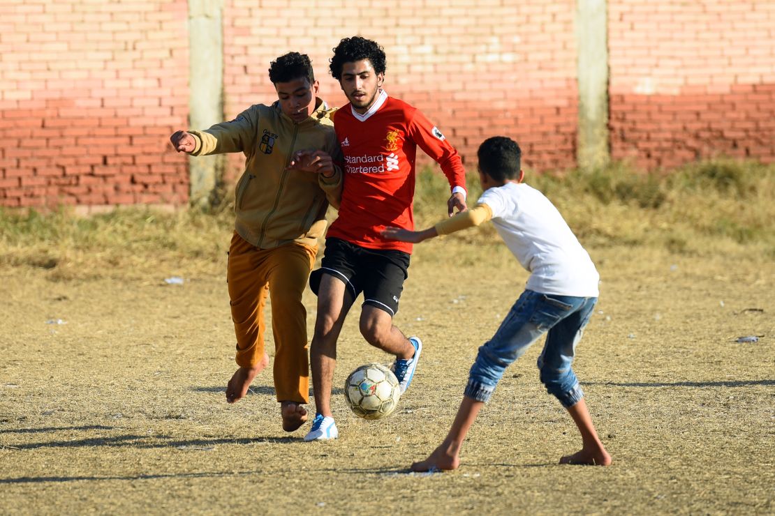 Egyptian boys play football at the Mohamed Salah Youth Center in the Egyptian village of Nagrig, about 120 kilometers northwest of Cairo.