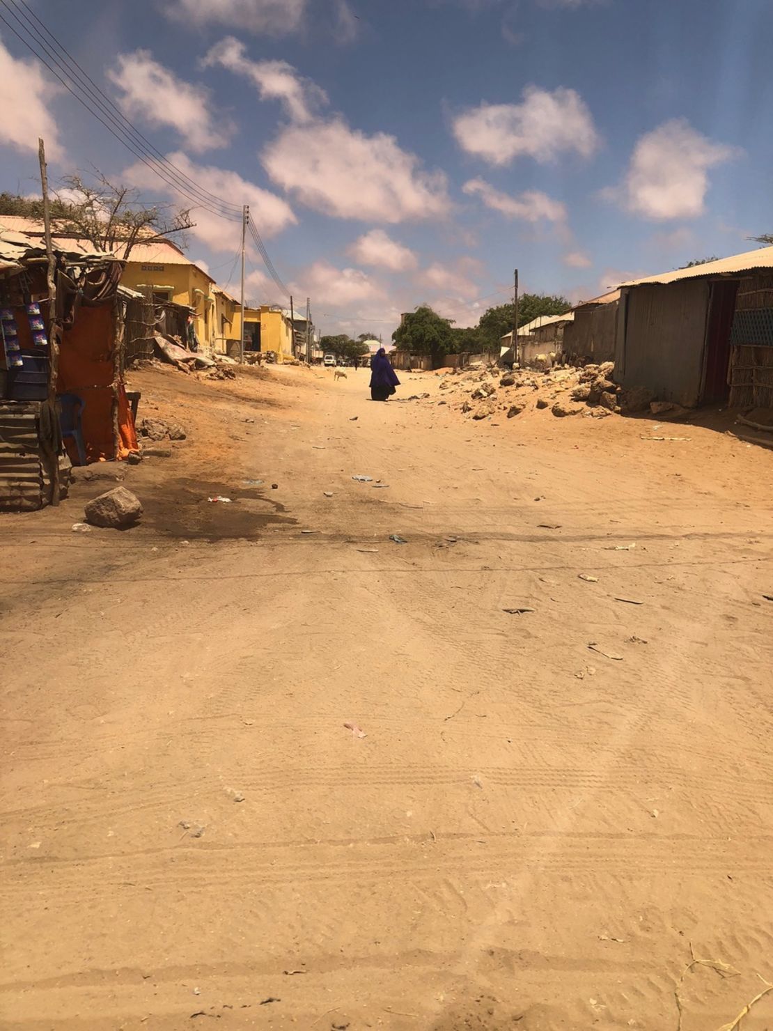  A woman walks along a street in the Somalian port city of Kismayo.