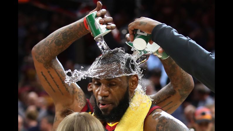 LeBron James is showered with water after a playoff win in Cleveland on Wednesday, April 25. <a href="index.php?page=&url=http%3A%2F%2Fbleacherreport.com%2Farticles%2F2772578-lebron-james-buzzer-beater-powers-cavaliers-past-pacers-in-game-5-win" target="_blank" target="_blank">James had just hit a 3-pointer at the buzzer</a> to defeat Indiana in Game 5 of the NBA's Eastern Conference quarterfinals. James and the Cavaliers went on to win the series in seven games.