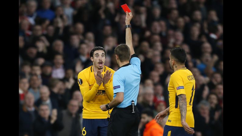 Atletico Madrid defender Sime Vrsaljko reacts as he is shown a red card during a Europa League semifinal match on Thursday, April 26. Vrsaljko received the red for a second bookable offense just 10 minutes into the match.
