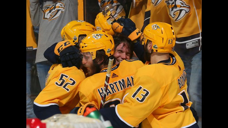 Kevin Fiala is swarmed by his Nashville teammates after scoring <a href="index.php?page=&url=https%3A%2F%2Fwww.instagram.com%2Fp%2FBiLfduOFxeK" target="_blank" target="_blank">the game-winning goal</a> in double overtime on Sunday, April 29. The Predators defeated Winnipeg 5-4 to tie their second-round playoff series at one game apiece.