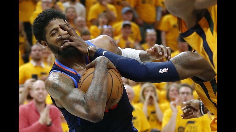 Oklahoma City forward Paul George is fouled by Utah's Jae Crowder during Game 6 of their first-round playoff series on Friday, April 27. 