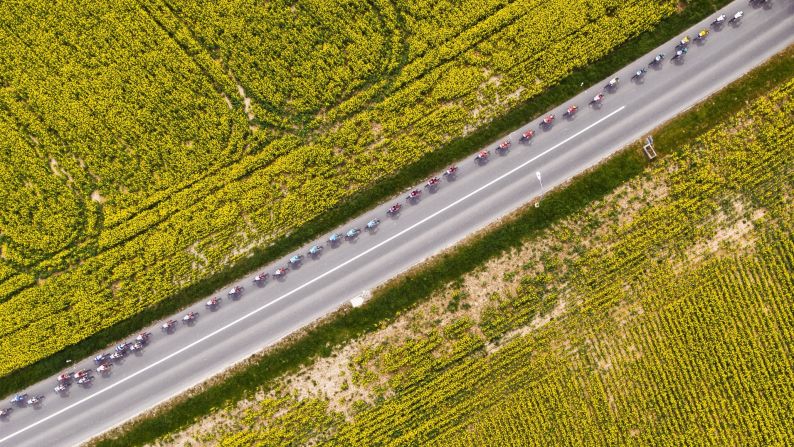 Cyclists ride between rapeseed fields in Switzerland during the last stage of the Tour de Romandie on Sunday, April 29.