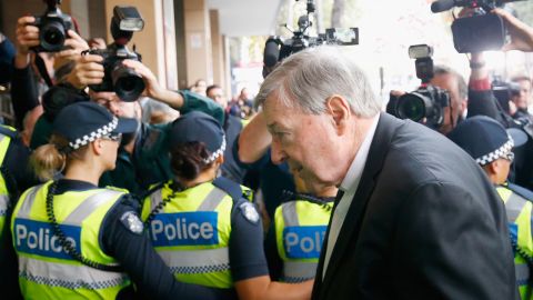 Police cordon off the media as Cardinal Pell walks into Melbourne Magistrates' Court on May 1, 2018.