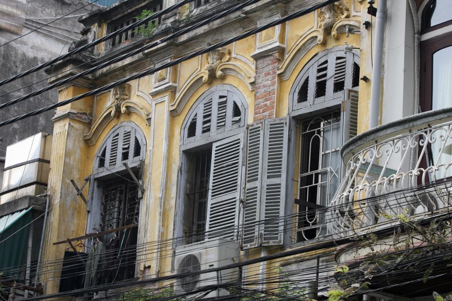 In downtown Hanoi, dilapidated colonial architecture co-exists with modern designs -- sometimes in the same structure.