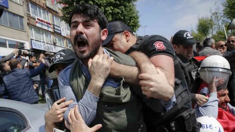 Police scuffle with protesters marching near Taksim Square in Istanbul.