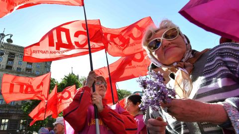 Trade unionists wave flags during a march in Kiev.