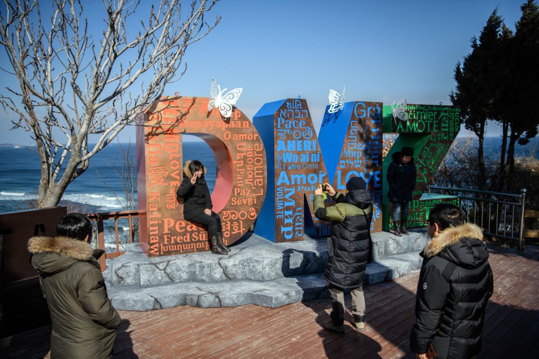 A tourist poses by the Goseong Unification Observatory.