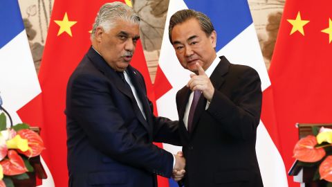China's Foreign Minister Wang Yi shakes hands with Dominican Republic's Chancellor Miguel Vargas during a signing ceremony on May 1  in Beijing, China.
