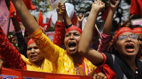 Garment workers attend a rally in the capital Dhaka. In 2013, more than 1,000 people died when a garment factory collapsed in the same city.