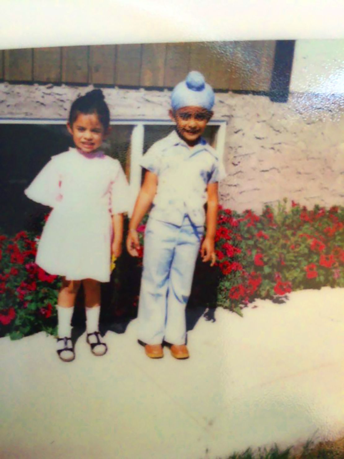 Winty Singh, with his sister Trishanjit as children, says he was bullied over his religion in school.