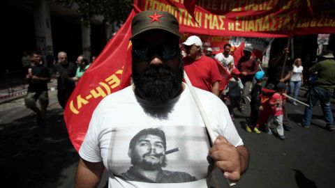 A demonstrator marches in Athens. A number of trade unions marked May Day with a 24-hour nationwide strike.