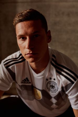 For Germany, Adidas looked to the past. The horizontal graphic printed across the chest recalls the uniform won by the German team that won the 1990 World Cup team. The gold crest symbolizes the defending champs' victory in 2014.