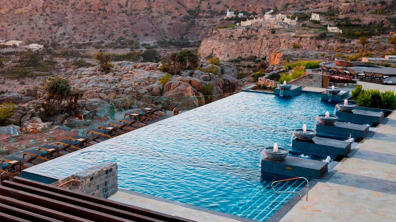 Pools overlook rugged mountains at the Antara Al Jabal Al Akhdar Resort.