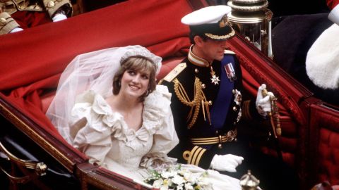 Prince Charles and Diana, who wears the Spencer family tiara, return to Buckingham Palace by carriage after their wedding in July 1981.