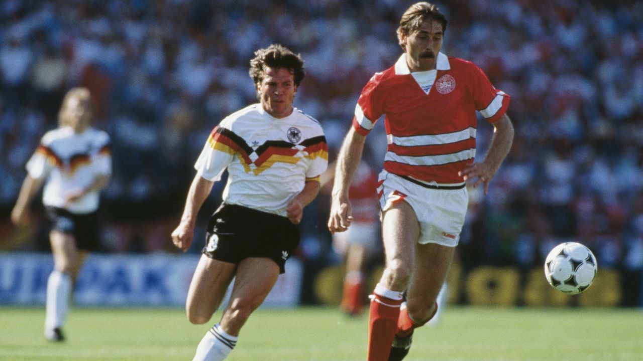 Ivan Nielsen of Denmark reaches the ball ahead of Lothar Matthaus of West Germany during the UEFA European Championships 1988 Group 1 match between West Germany and Denmark held on June 14, 1988 at the Parkstadion in Gelsenkirchen, West Germany.