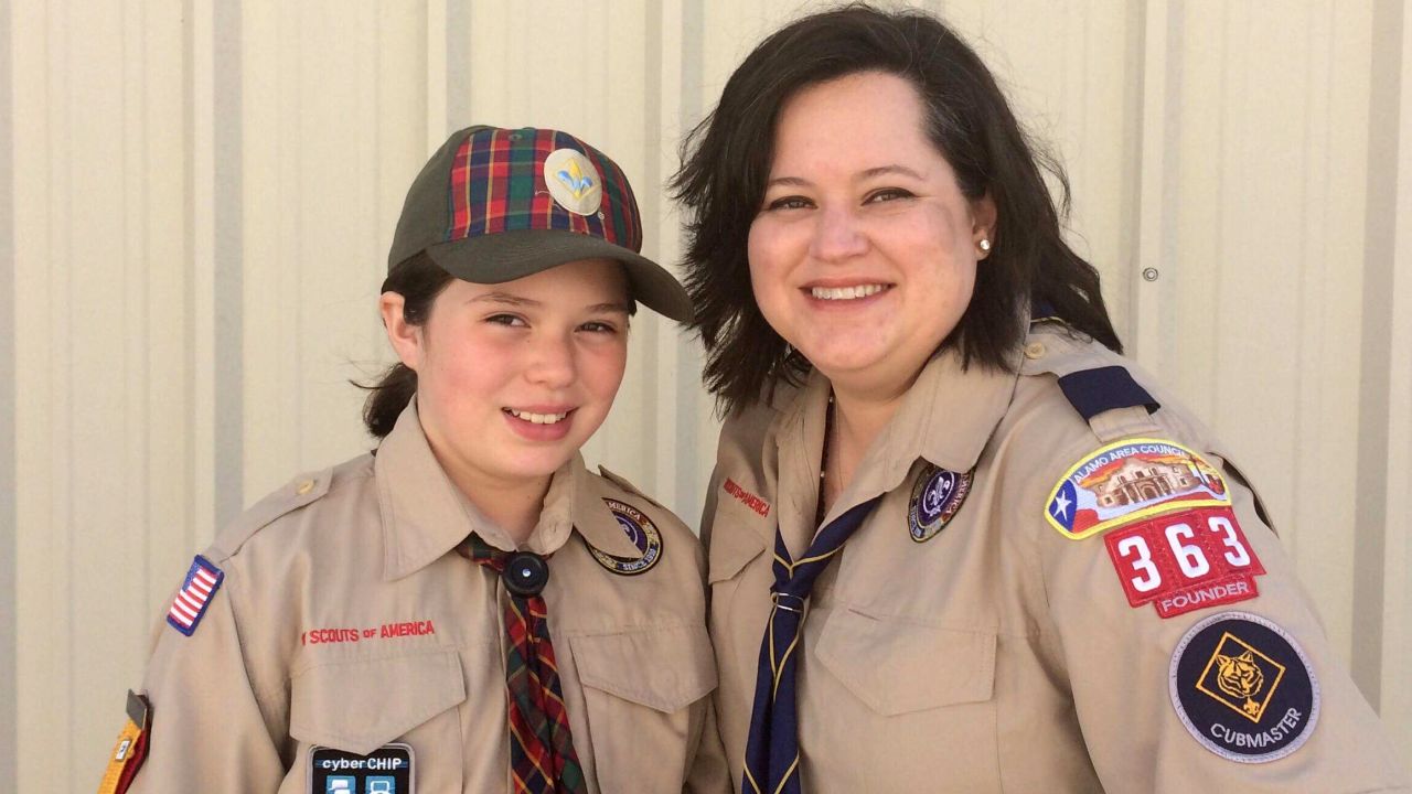 Ana and her mom pose for a photo after scout event.