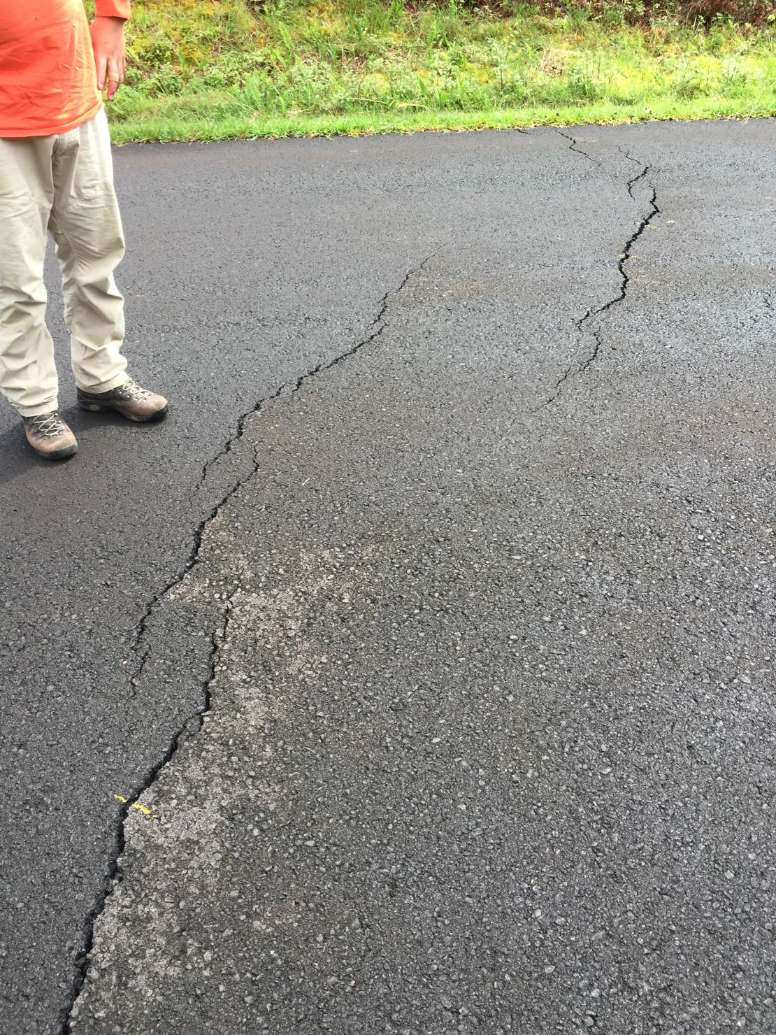 Small cracks are visible on roads in the Leilani Estates subdivision after quakes rattled the Big Island.