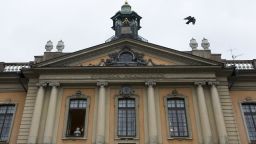 A bird flies from the rooftop of the Royal Swedish Academy on October 7, 2010. Peruvian-Spanish author Mario Vargas Llosa won the 2010 Nobel Literature Prize on Thursday, the Swedish Academy said.    The 74-year-old author, a one-time presidential candidate, is best known for works such as "Conversation in the Cathedral" and "The Feast of the Goat" but is also a prolific journalist.  AFP PHOTO / JONATHAN NACKSTRAND (Photo credit should read JONATHAN NACKSTRAND/AFP/Getty Images)