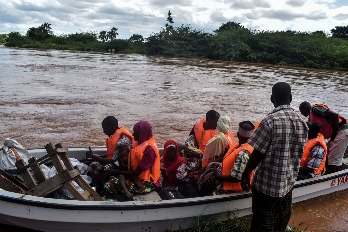 The Kenyan Red Cross uses a boat to evacuate people from their flooded village after the Tana River overflowed in coastal Kenya on April 27, 2018.