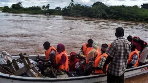 The Kenyan Red Cross uses a boat to evacuate people from their flooded village after the Tana River overflowed in coastal Kenya on April 27, 2018.