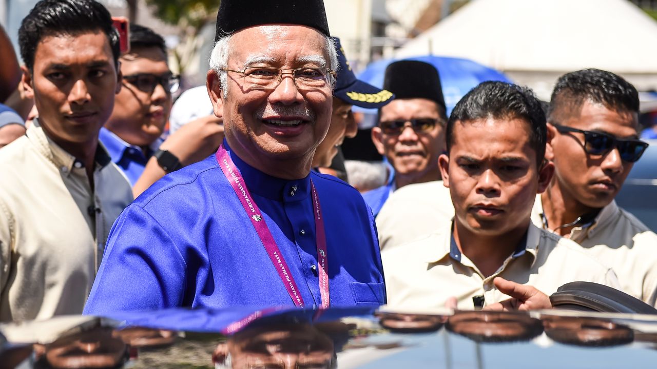 Malaysia's Prime Minister Najib Razak smiles as he leaves after submitting his documents at the nomination centre in Pekan on April 28.