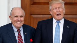 President-elect Donald Trump calls out to media as he and former New York Mayor Rudy Giuliani pose for photographs as Giuliani arrives at the Trump National Golf Club Bedminster clubhouse, Sunday, Nov. 20, 2016, in Bedminster, N.J.. (AP Photo/Carolyn Kaster)