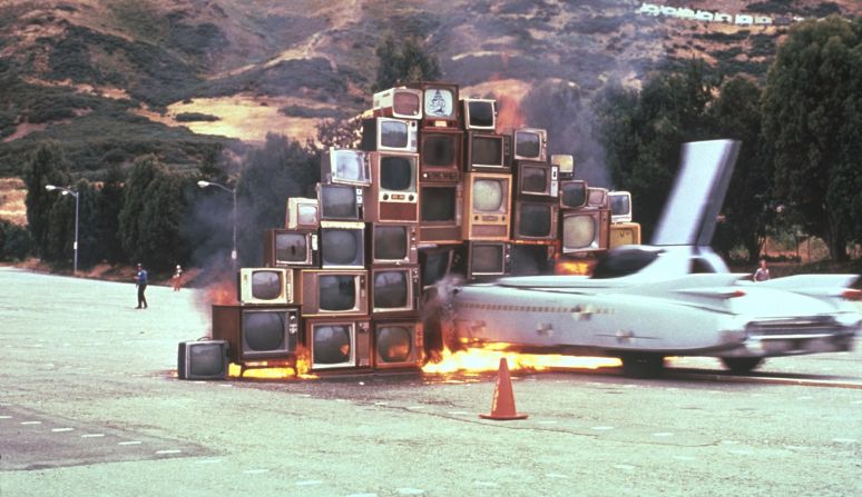 Later on, Ant Farm had moved into "the realm of the radically changing art world of the 1970s." Their creations ranged from performance and video to sculpture and public art. Inspired by the prevalence of TV in everyday life, "Media Burn" featured a Cadillac being driven into burning TV sets. The set was inspired by typical TV news coverage of a space launch.