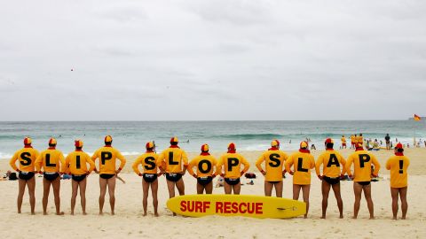 Volunteer lifesavers unite for the anti-skin cancer Slip Slop Slap campaign at Bondi Beach in Sydney in January 2006.