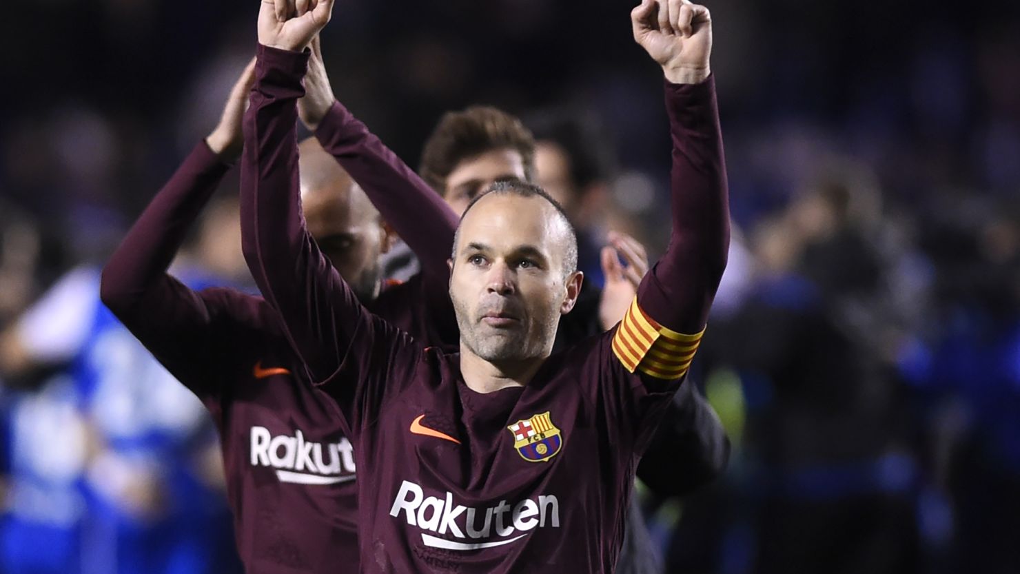 Barcelona midfielder Andres Iniesta celebrates after his team won the Spanish league against Deportivo Coruna to claim its 25th La Liga title. 