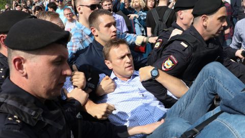 Russian police carry opposition leader Alexei Navalny, center, at an anti-Putin protest Saturday in Moscow.