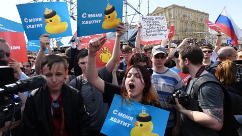 Opposition supporters hold placards and shout slogans during Saturday's anti-Putin rally in Moscow.