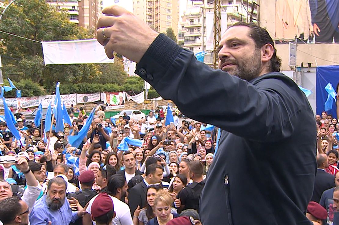 Prime Minister Saad Hariri takes a selfie with supporters. 