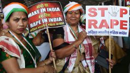 Supporters of President of the Indian National Congress Party Rahul Gandhi hold placards in reaction to the recent rape cases in India at a New Delhi rally on April 29, 2018.