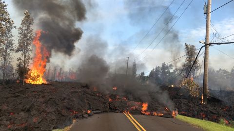 Lava slowly advances on Hookapu Street in Leilani Estates Saturday.