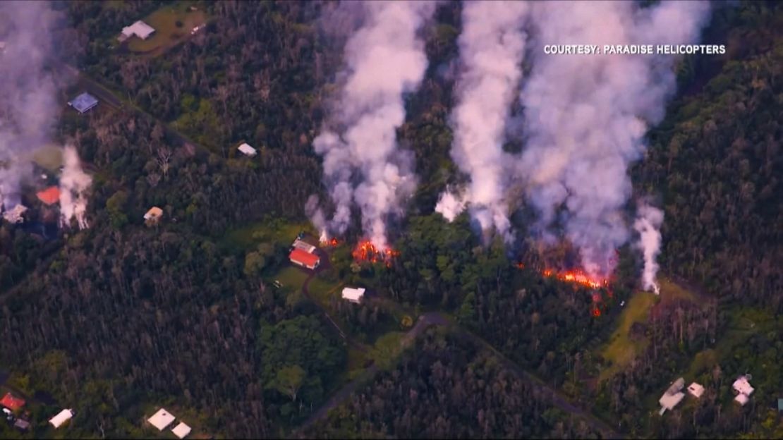 Aerial footage shows lava spilling from a fissure.