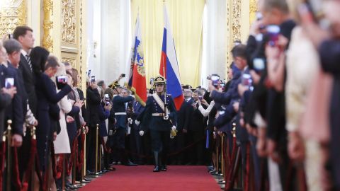 Honour Guards carry the Russian Presidential Standard and Russian National Flag during the  ceremony in the Kremlin.