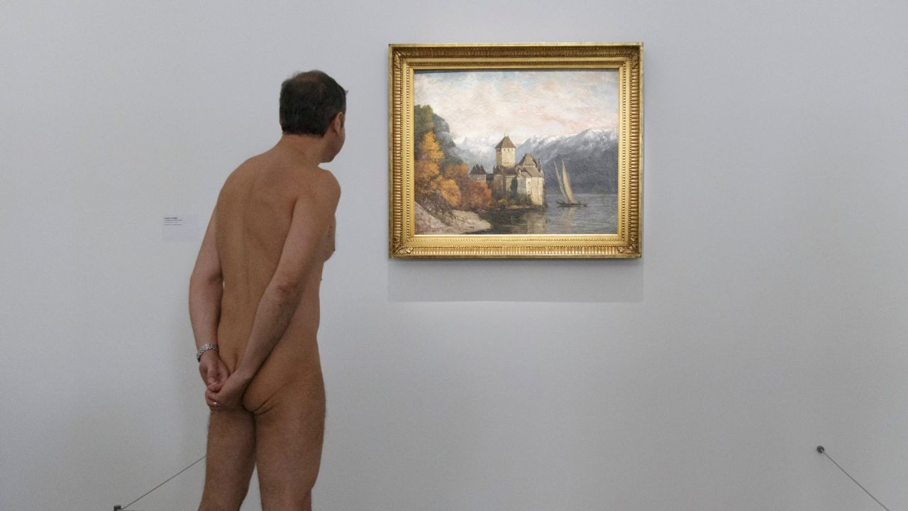 Nudists check out the "Discorde, Fille de la Nuit" exhibition at the Palais de Tokyo museum in Paris.