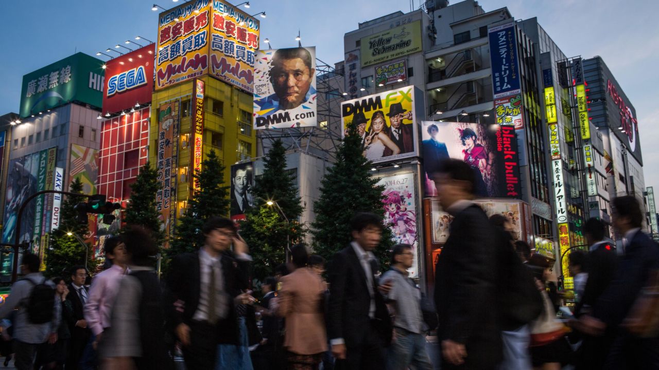 TOKYO, JAPAN - MAY 19:  People walk on the street in Akihabara, Electric Town on May 19, 2014 in Tokyo, Japan. Akihabara gained the nickname Akihabara Electric Town after World War II as it became a mecca for household electronic goods. Today Akihabara has become a major Tokyo tourist attraction and Otaku cultural center.  Otaku is a Japanese term for people with obsessive interests and is often associated with the anime and manga movements.  The district is cluttered with stores specializing in anime, video games, manga, collectibles and maid cafes.  (Photo by Chris McGrath/Getty Images)